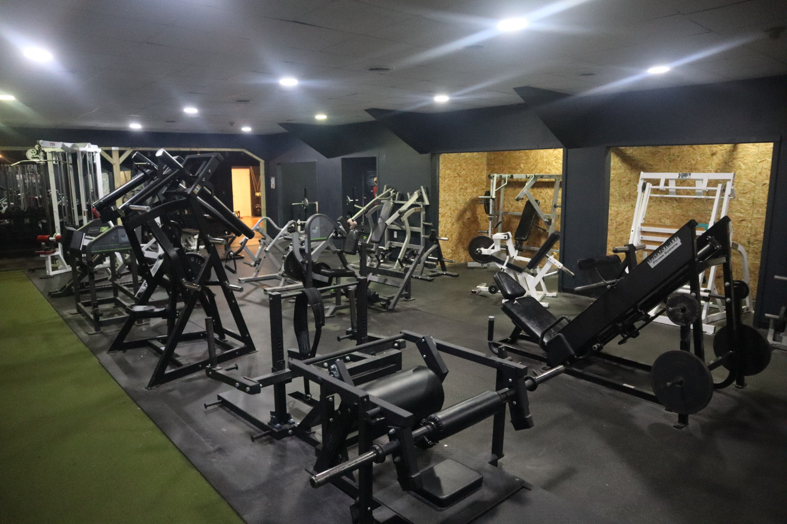 Bodybuilding machines arranged across the Mifflinburg Muscle & Fitness floor